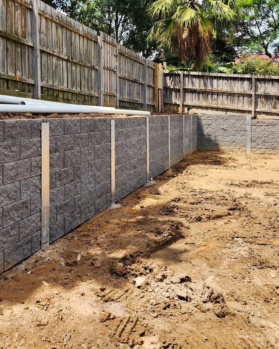 Subsoil drainage behind a retaining wall before backfill