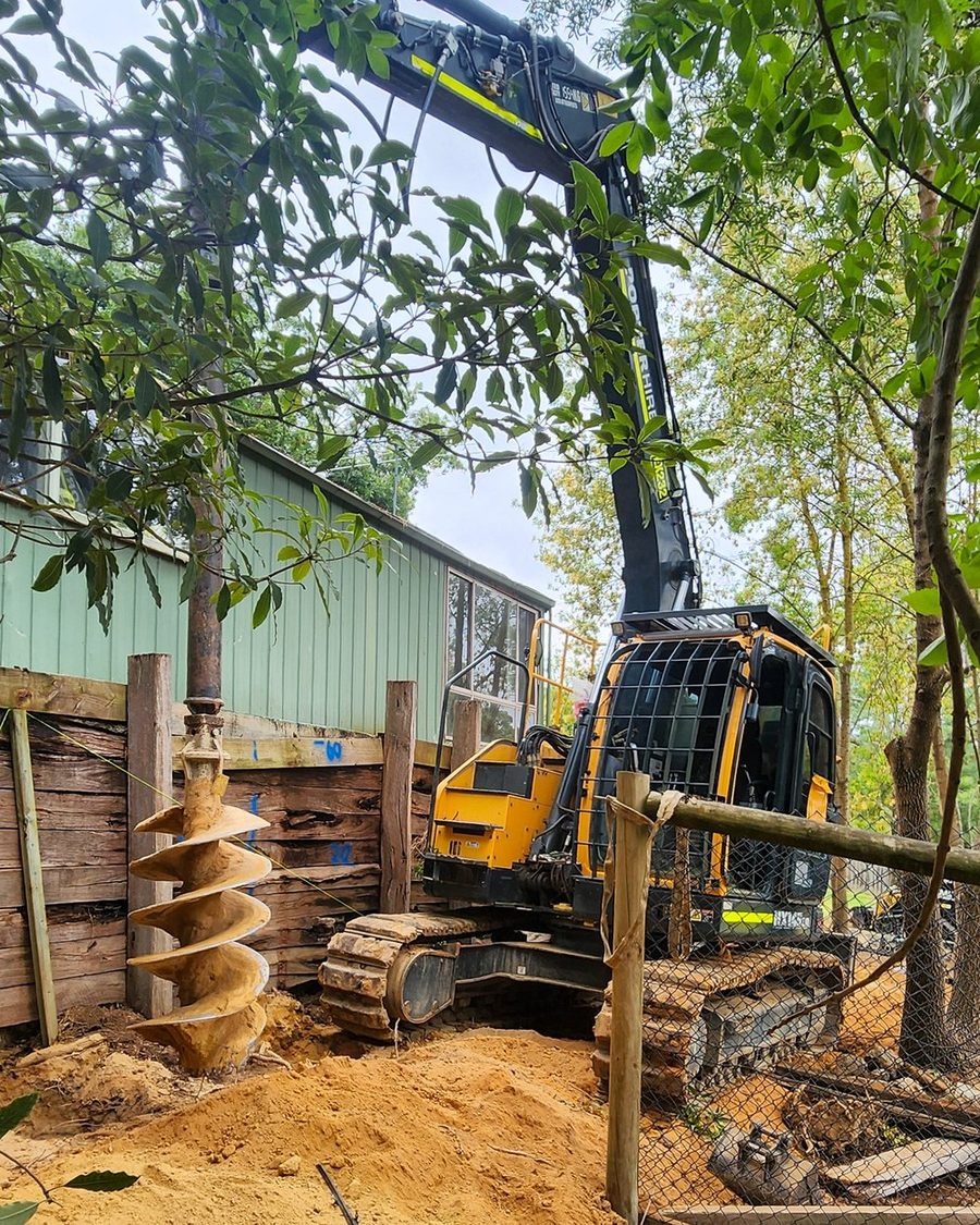Auger drilling retaining wall footings