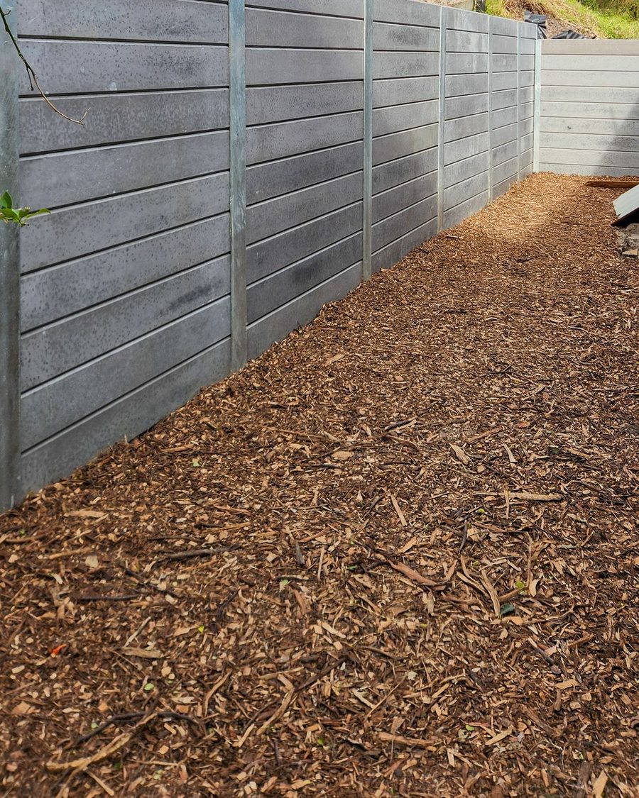 Concrete sleeper wall stepping down a slope