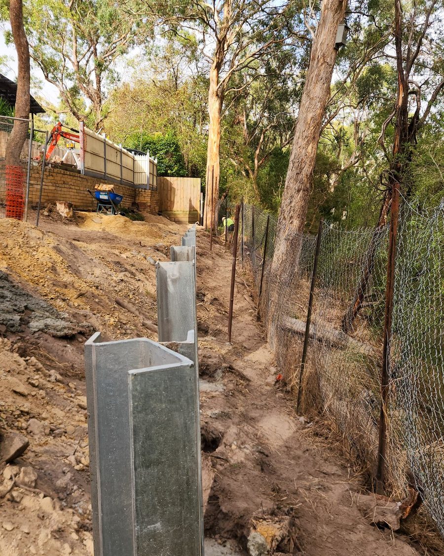 Galvanised steel posts set in engineered footings